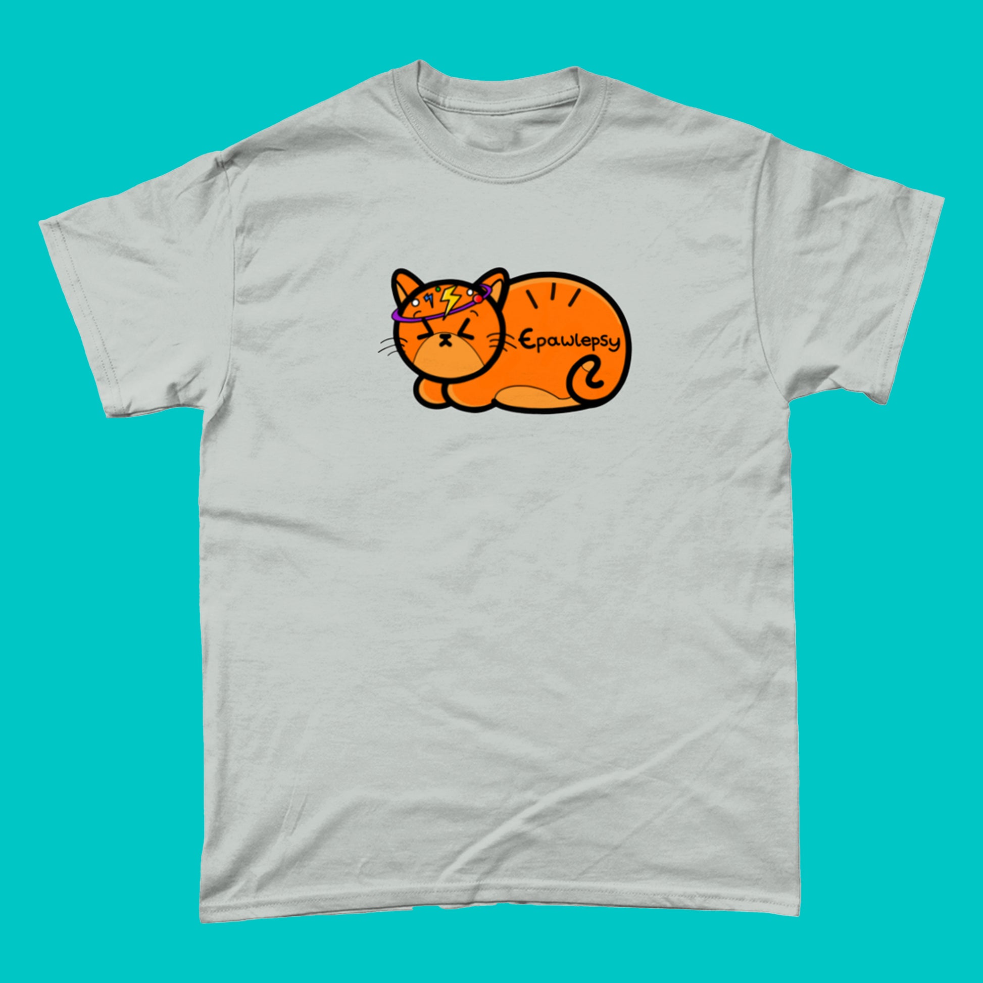 Epawlepsy Tee - Epilepsy. The ash grey cotton t-shirt is a ginger cat with eyes scrunched closed and symbols to represent a dizzy spell drawn across his head. Epawlepsy is written on the cats stomach. Tee is designed to raise awareness for epilepsy.