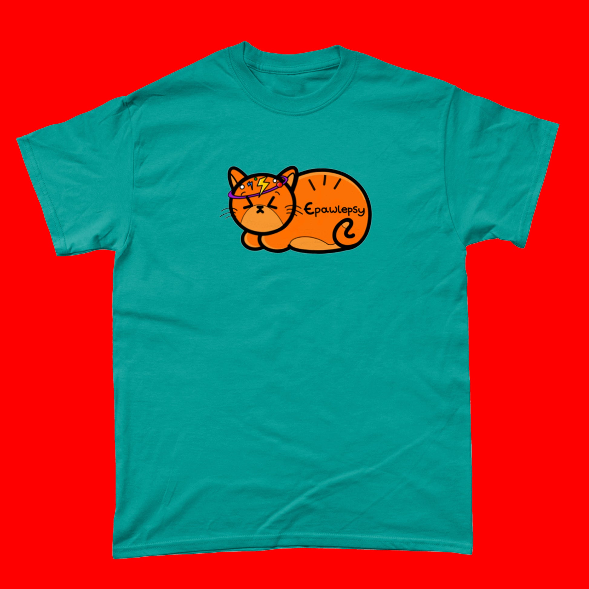 Epawlepsy Tee - Epilepsy. The antique jade cotton t-shirt is a ginger cat with eyes scrunched closed and symbols to represent a dizzy spell drawn across his head. Epawlepsy is written on the cats stomach. Tee is designed to raise awareness for epilepsy