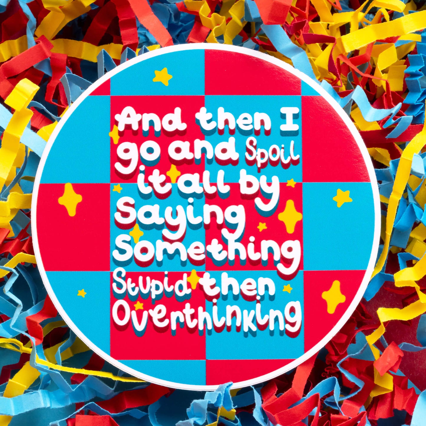 Innabox sticker with a colourful design featuring the quote 'And then I go and spoil it all by saying something stupid then overthinking.' Set against a background of red, yellow, and blue paper confetti, this sticker captures the relatable struggles of overthinking, perfect for those living with chronic illnesses or hidden disabilities looking for a touch of humour and comfort.