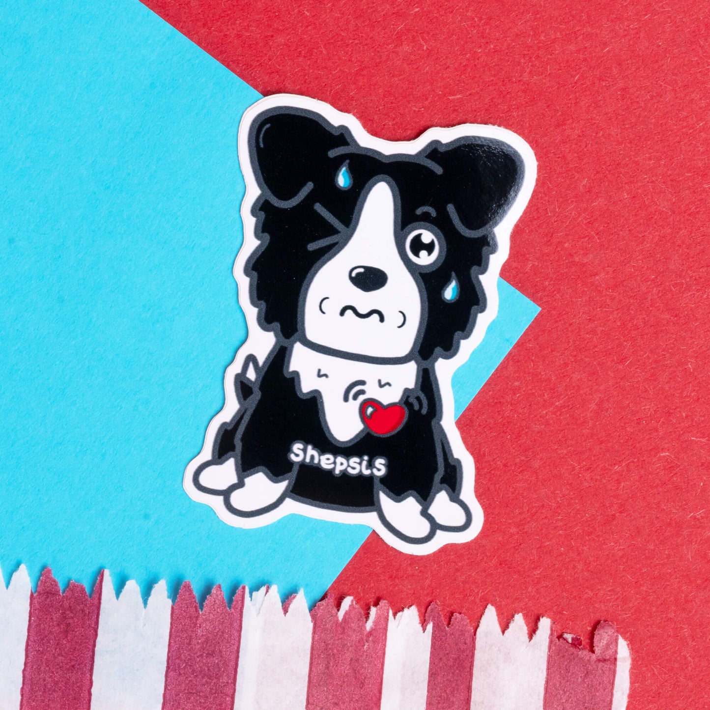 Innabox sticker featuring a cute black and white sheepdog with one eye wincing shut and a tear drop, displaying the wordplay 'Shepsis' to raise awareness for sepsis. The dog has a heart emblem on its chest, symbolising love and care for those with chronic illnesses and hidden disabilities. Set against a colourful background with red and blue elements, this sticker by Innabox aims to uplift and spread awareness of health conditions.