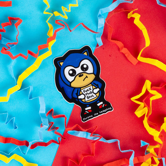 Innabox sticker featuring 'Chronic the Hedgehog,' a blue cartoon character holding a sign saying, 'F*** This Sh**.' A humorous and relatable design for those with chronic illness or daily struggles, surrounded by bright confetti.