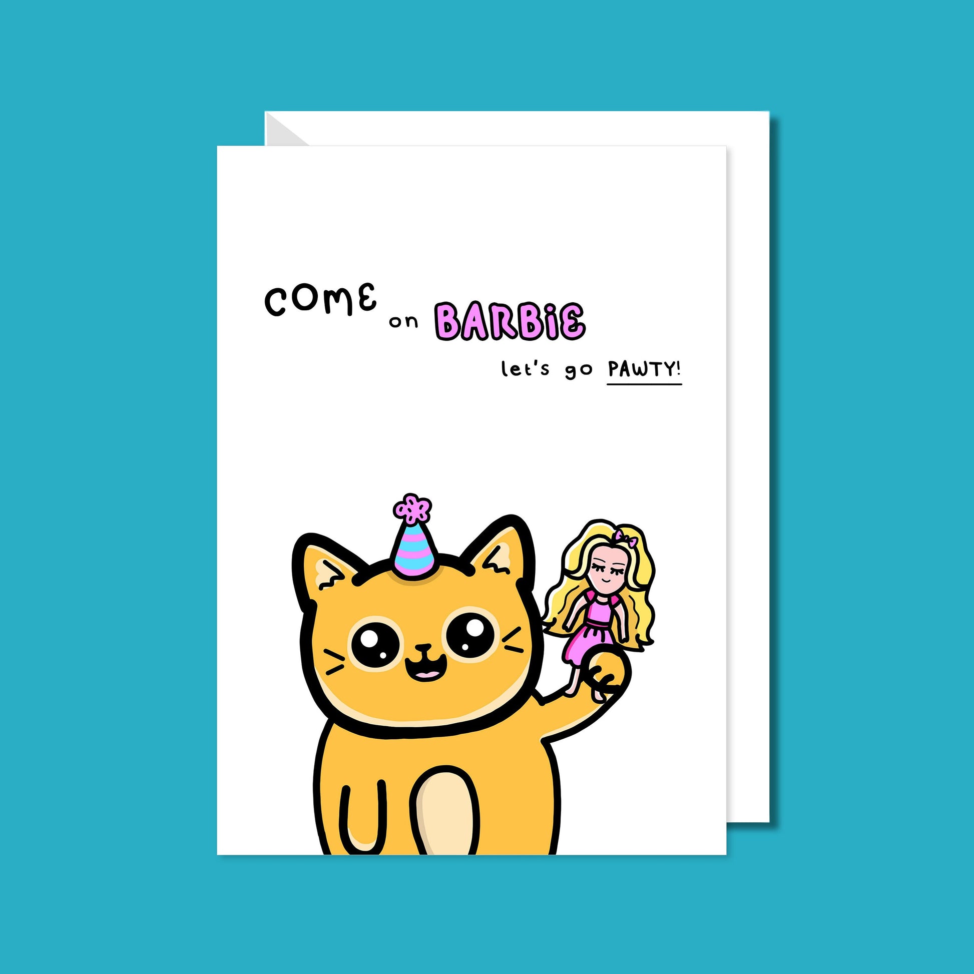 The Let's Go Pawty Cat Birthday Card on a blue background with a white envelope underneath. The white background a6 card has a yellow smiling cat with a pastel party hat holding up a pink dressed doll with blonde hair. Above the cat in black text reads 'come on barbie let's go pawty!'. The barbie section of the text is pink bubble writing.